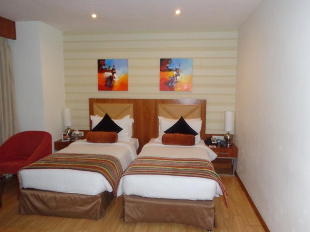 Hotel Ramada Ahmadábád Pokoj fotografie